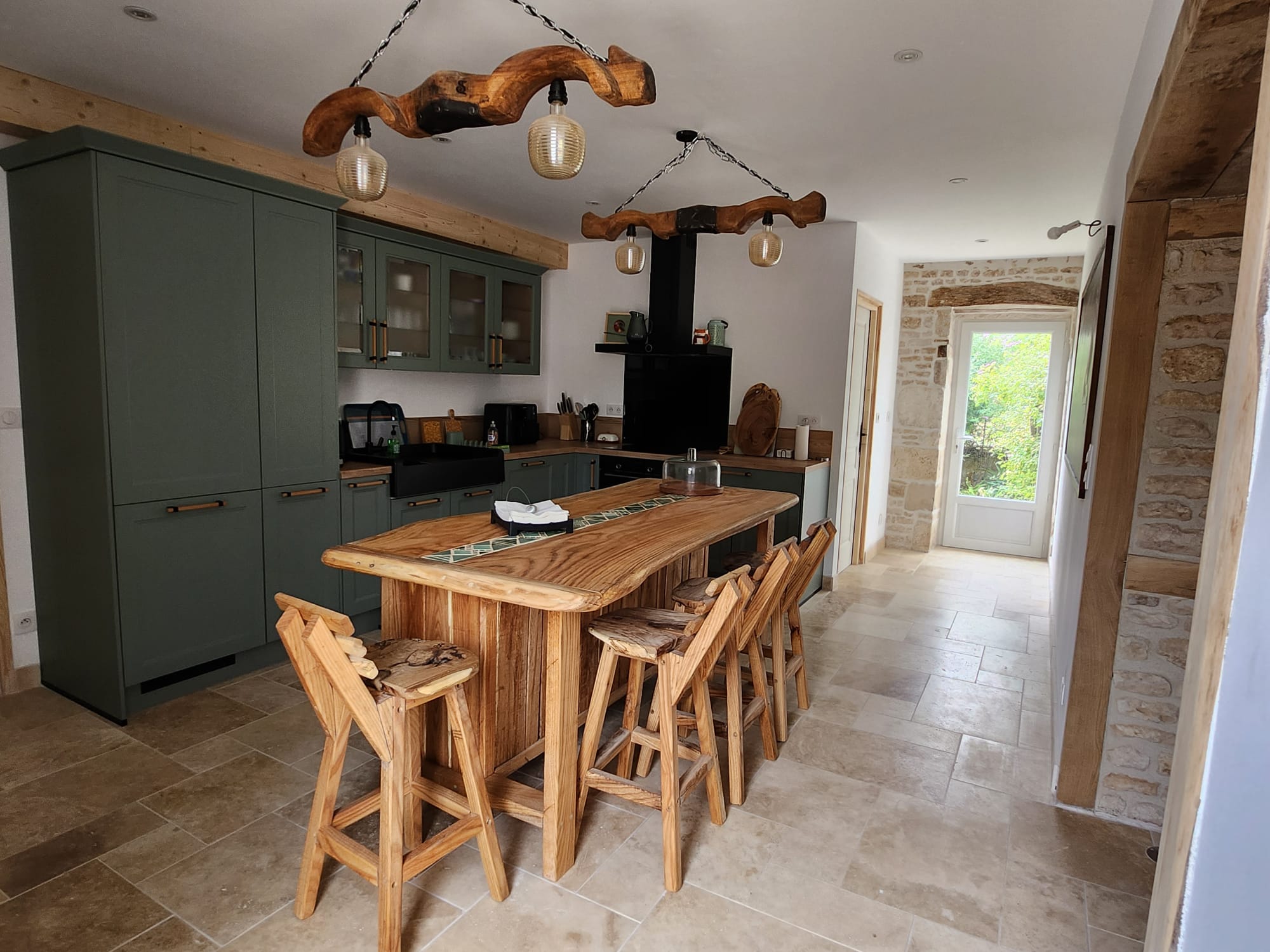 Kitchen with live-edge central island and bar stools
